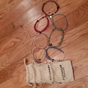 Set of 7 Puravida bracelets and 4 Bags